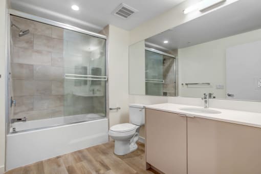 a bathroom with a toilet sink and bathtub