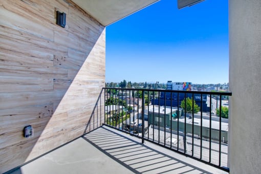 a balcony with a view of the city
