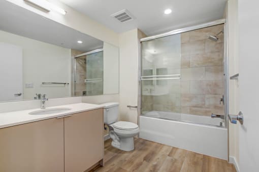 a bathroom with a toilet sink and bathtub