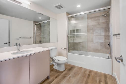a bathroom with a toilet sink and bathtub