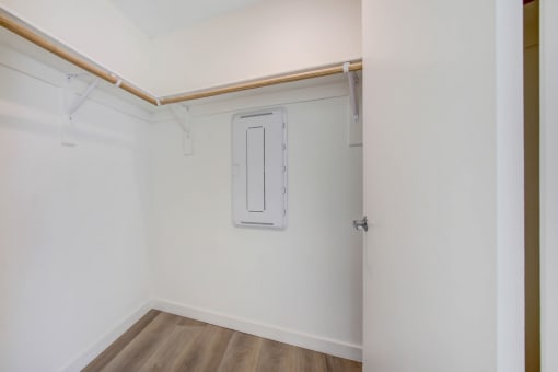 a room with white walls and a wooden floor