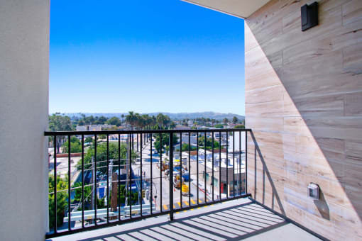 a balcony with a view of a parking lot