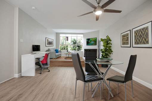 Dining area with a ceiling fan, wood style floors