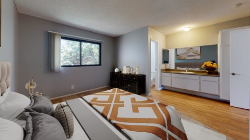 a living room with a couch and a bed and a bathroom