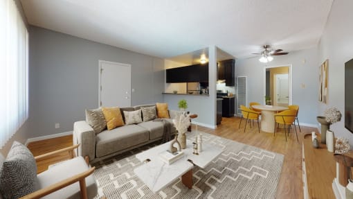 an open living room and dining room with a couch and a table