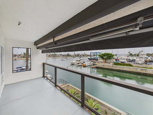 A balcony with a view of a marina.