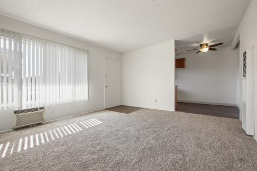 Living room with carpeted flooring, air conditioning