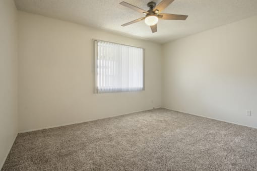 Bedroom with carpeted flooring, and ceiling fan