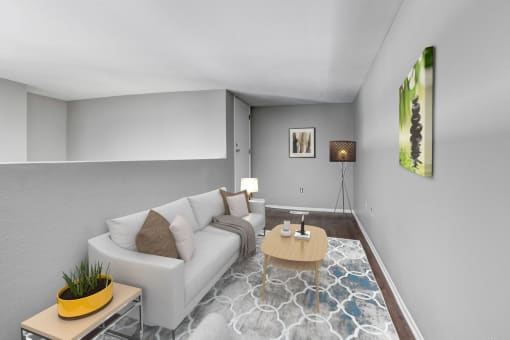 a living room with grey walls and a white couch