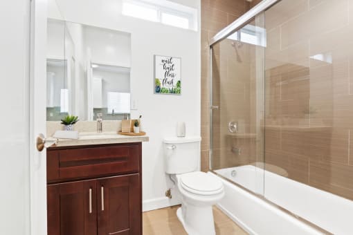 a bathroom with a toilet sink and bathtub
