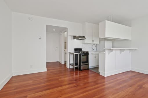 a kitchen and living room in a 555 waverly unit