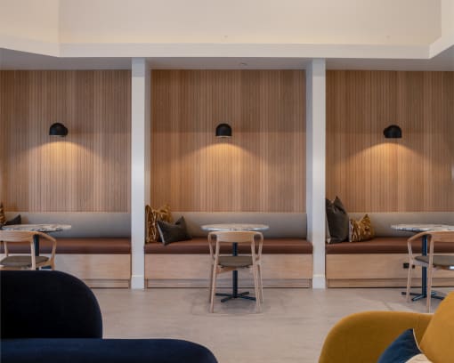 a restaurant with wooden walls and tables and chairs