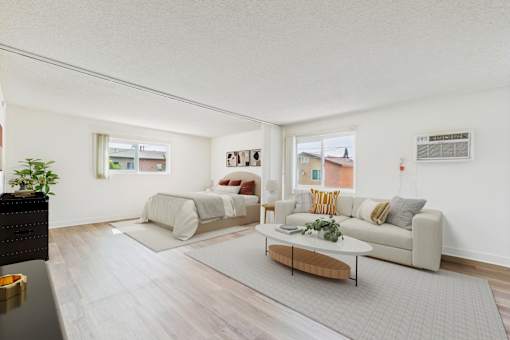 A living room with a grey sofa and a coffee table.