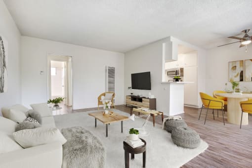 the living room of an apartment with a couch and a table