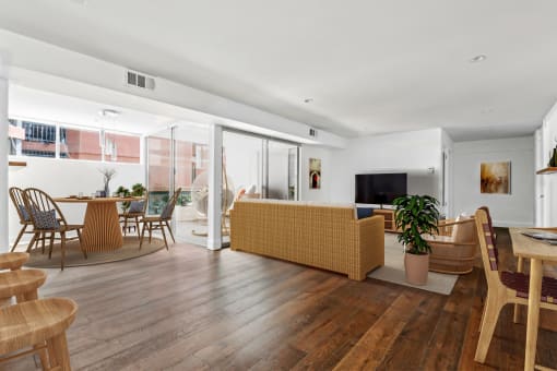 a living room and dining area with a couch and a table