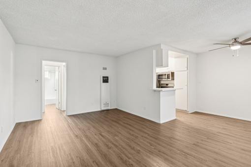 A room with wooden floors and white walls.