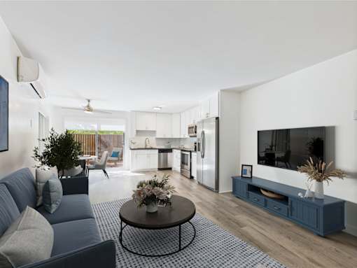 A modern living room with a grey sofa and a coffee table.