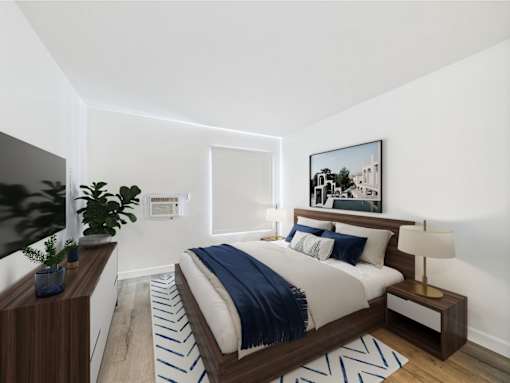 A modern bedroom with a large bed and a painting on the wall.