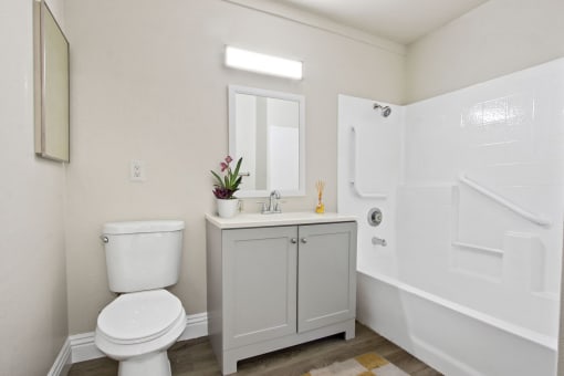 a bathroom with a toilet sink and bathtub