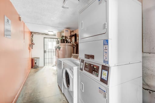 a laundry room with a washer and a dryer in it
