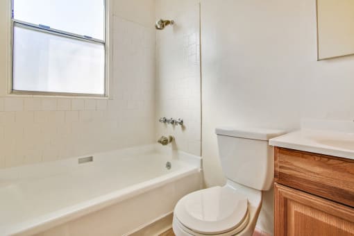 Bathroom With Tub and Shower Combo, Wood Style Flooring