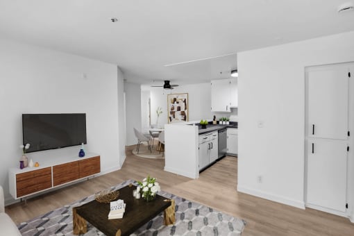 a living room with a table and a television