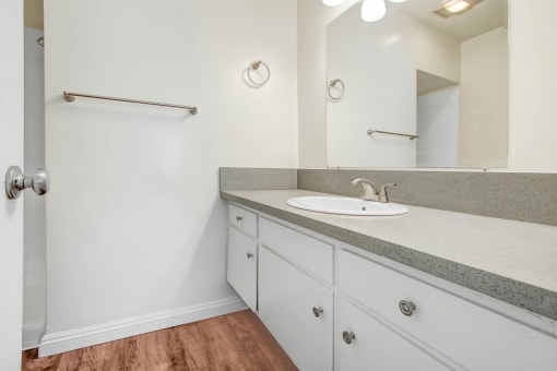 the preserve at ballantyne commons apartment bathroom with sink and mirror