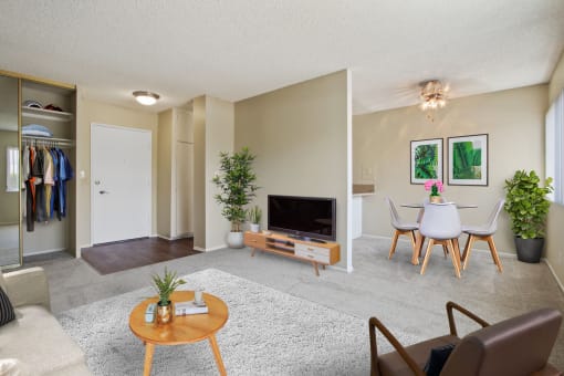 Living room and dining area with carpeted floors throughout