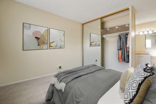 Bedroom with a mirrored closet doors