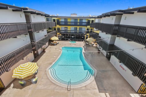 Resort-style swimming pool with lounge just steps from your front door