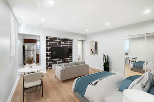 a living room with a bed and a couch