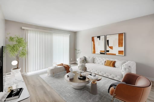 a living room with a white couch and a coffee table