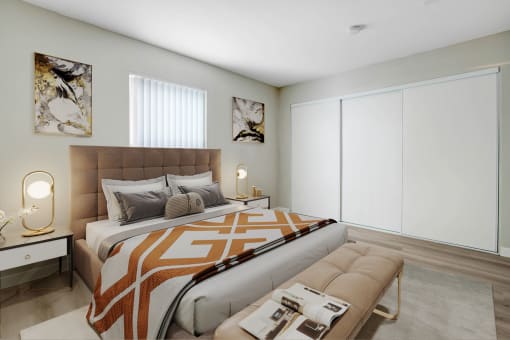 a bedroom with a bed and a large window