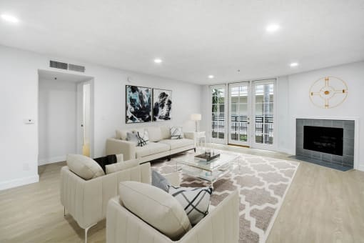 a living room with two couches and a fireplace