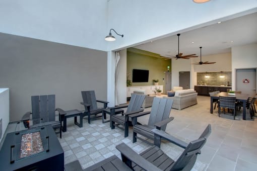 a dining area with a table and chairs and a living room