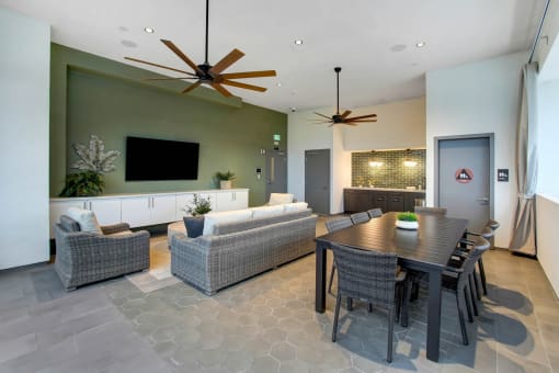 a dining room and living room with a table and chairs