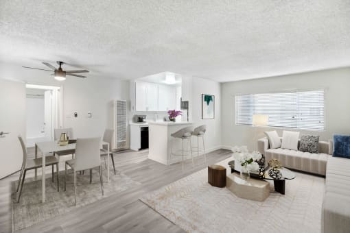 a living room with a couch and a dining table