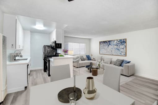 an open living room and kitchen with a white table