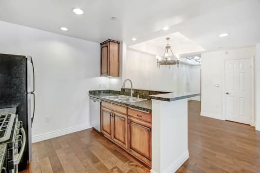 a kitchen with a counter top and a refrigerator