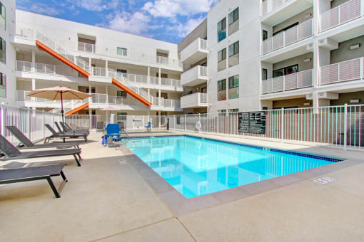 a swimming pool in the middle of an apartment building