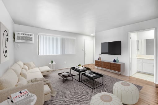 a living room with a couch and a tv