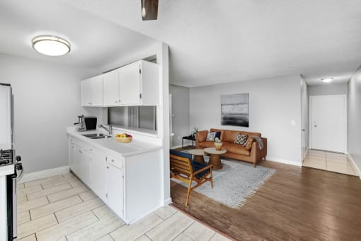 a living room with a kitchen and a couch
