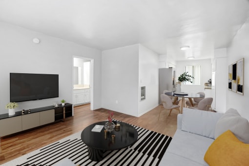 a living room with a couch and a table and a tv