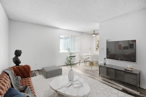 a living room with a couch and a tv