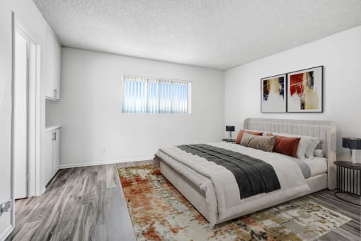a bedroom with a bed and a window