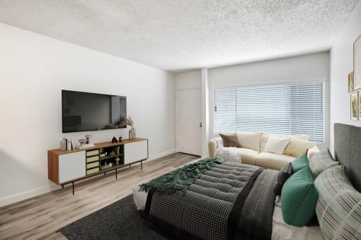 a living room with a couch and a tv