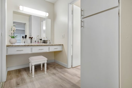a bathroom with a vanity and a mirror