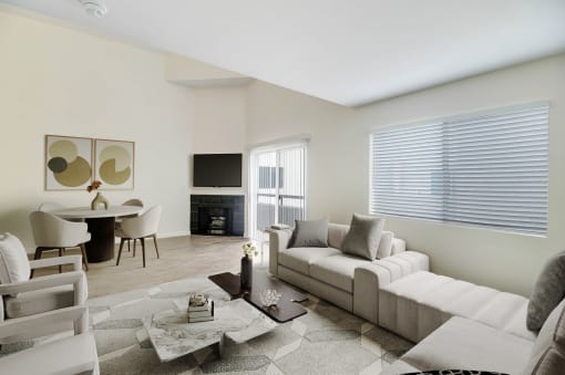 a living room with a white couch and a table with chairs