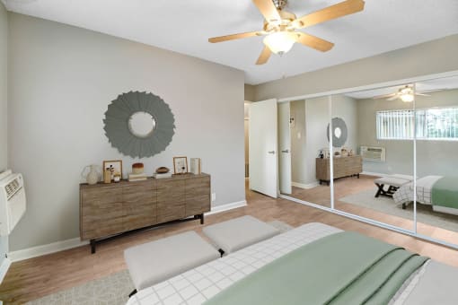 a bedroom with a bed and a ceiling fan