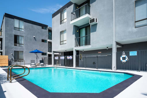 a swimming pool in front of a building